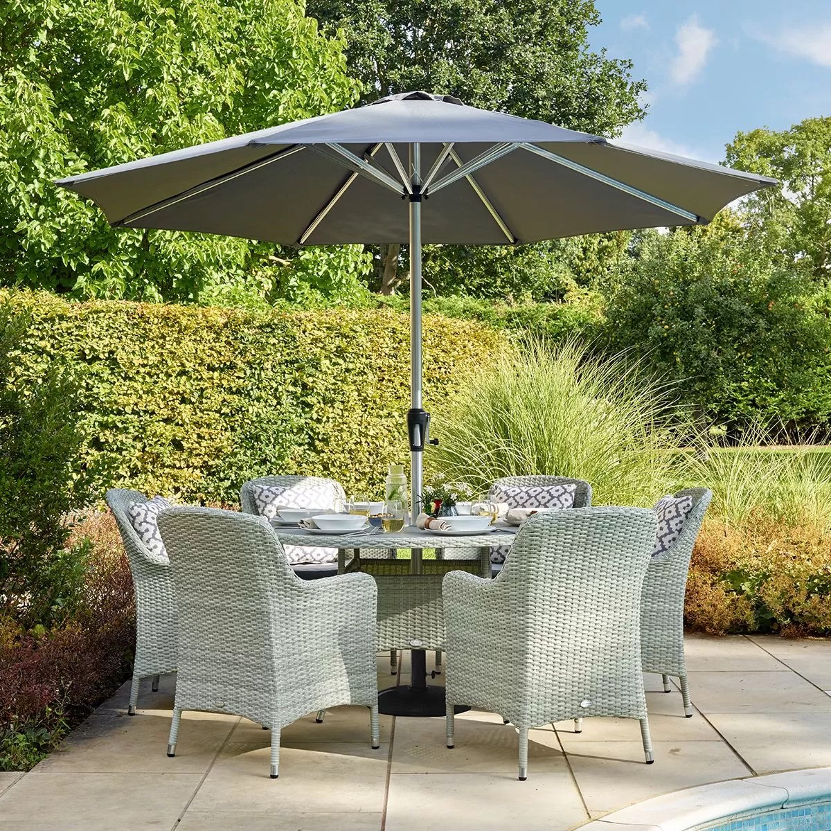 Bramblecrest Tetbury 6 Seater Round Dining Set With Parasol & Base 1 Bramblecrest Tetbury 6 Seater Round Dining Set With Parasol & Base
